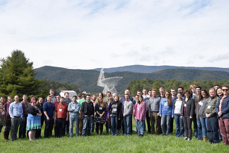 team of scientists pose for a picture near Green Bank Observatory